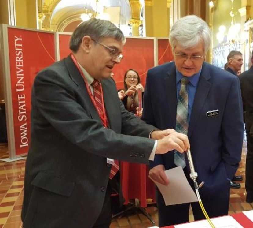Dr. David Laird demonstrates the company's soil nitrate sensor to State Representative Jeff Kurtz